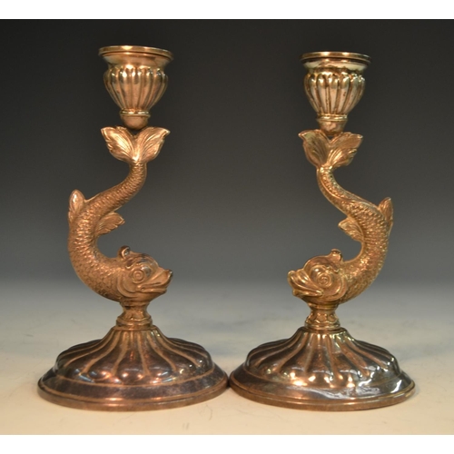 767 - A pair of Spanish silver candlesticks, dolphin stems, fluted sconces and bases, 16cm high