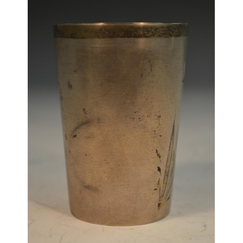 776 - A Russian parcel-gilt silver tapered cylindrical beaker, engraved with flowers and a C-scroll cartou... 