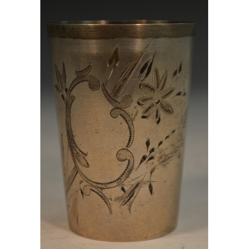 776 - A Russian parcel-gilt silver tapered cylindrical beaker, engraved with flowers and a C-scroll cartou... 