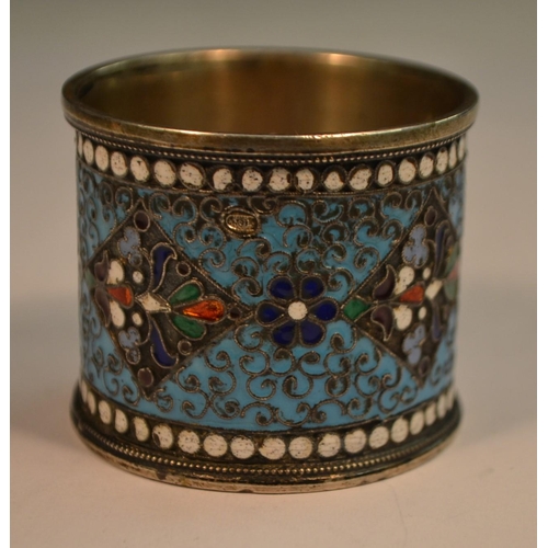 778 - A Russian silver and cloisonne enamel napkin ring, brightly decorated in polychrome, white 'jewelled... 