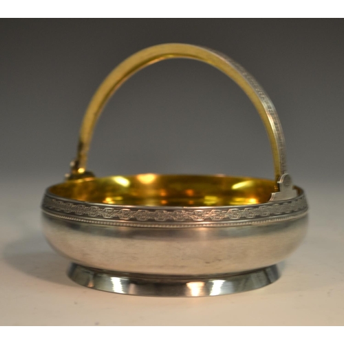 784 - A Russian silver circular swing-handled basket, gilt interior, 10.5cm wide, 875 standard