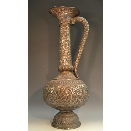 794 - A substantial 19th century Indian Kutch silver baluster ewer, shaped flared rim, fluted shoulder, do... 