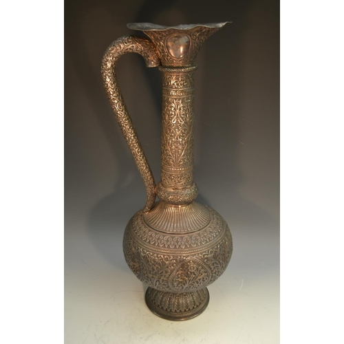 794 - A substantial 19th century Indian Kutch silver baluster ewer, shaped flared rim, fluted shoulder, do... 