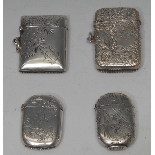 798 - A Victorian Aesthetic Movement silver rounded rectangular vesta case, chased with swallows and sprou... 