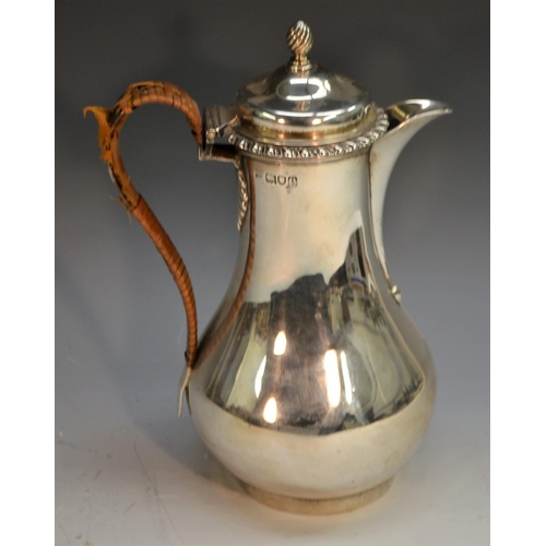 809 - A Victorian silver baluster water jug, hinged cover with spiral-knop finial, gadrooned rim, wicker-w... 