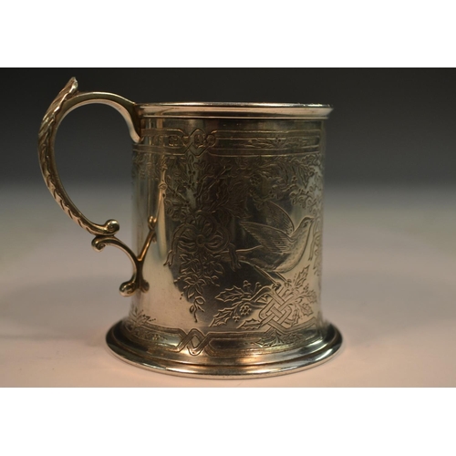 810 - A Victorian silver cylindrical child's mug, well engraved with birds amongst ribbon-tied foliage, ac... 