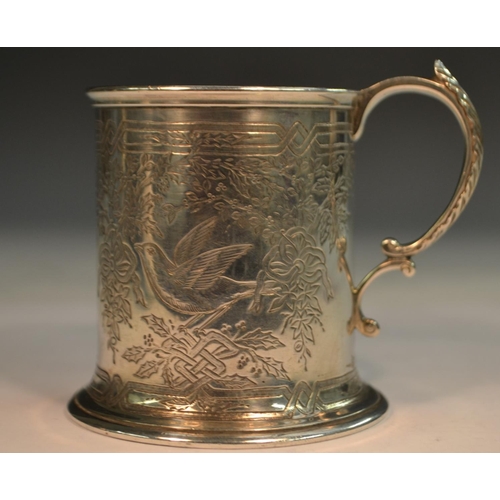 810 - A Victorian silver cylindrical child's mug, well engraved with birds amongst ribbon-tied foliage, ac... 