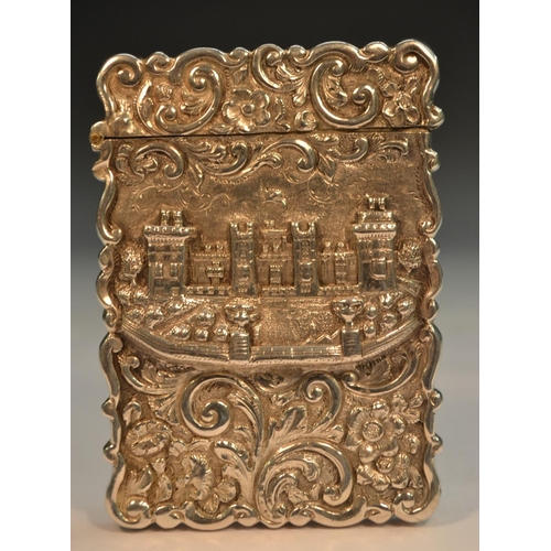 819 - A Victorian silver shaped rectangular castle top visiting card case, embossed with a view of Windsor... 