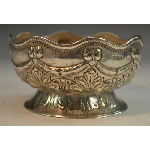 820 - A Victorian silver sugar bowl, undulating lip, embossed ribbon bow swag above foliate body and foot,... 