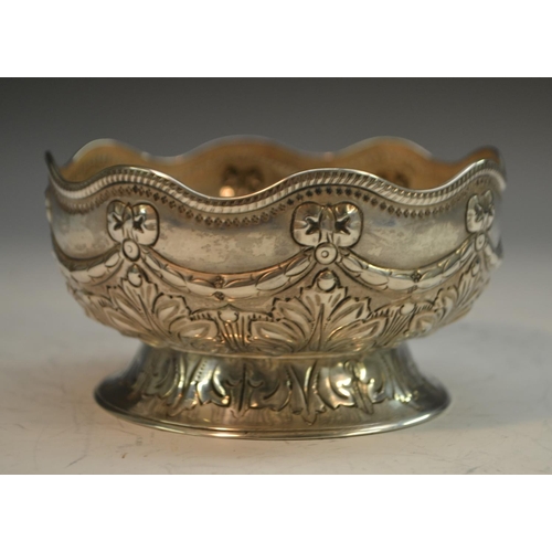 820 - A Victorian silver sugar bowl, undulating lip, embossed ribbon bow swag above foliate body and foot,... 