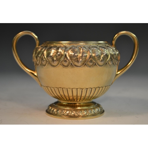 821 - A Victorian silver-gilt bachelor's tea service, comprising bullet shaped teapot, milk jug and sugar ... 