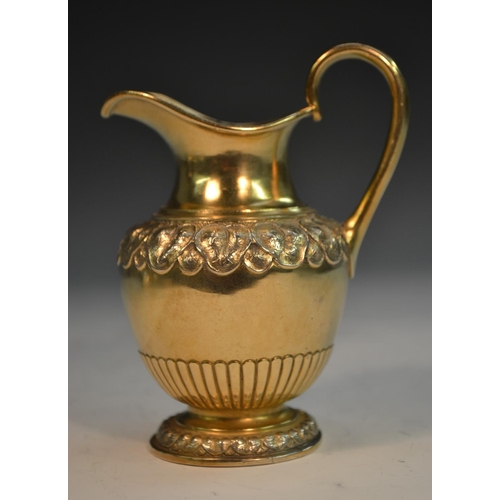 821 - A Victorian silver-gilt bachelor's tea service, comprising bullet shaped teapot, milk jug and sugar ... 