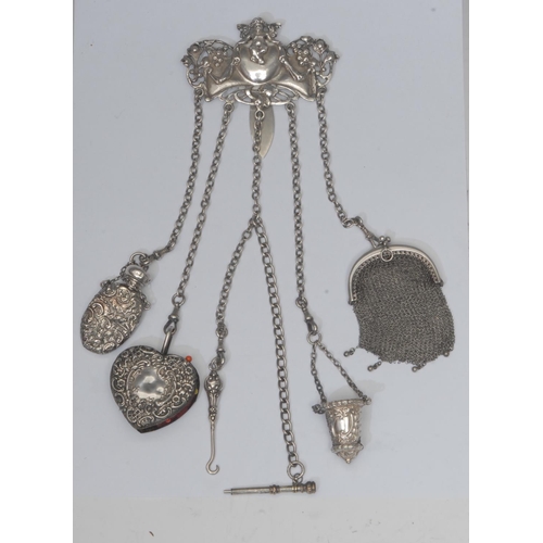 823 - A Victorian/Edwardian Art Nouveau five drop silver chatelaine, pierced cast Cherub and fruiting vine... 