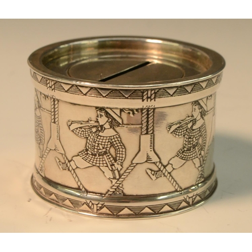 841 - An American silver novelty money box, as a drum, the side embossed with children marching, 7cm diam,... 