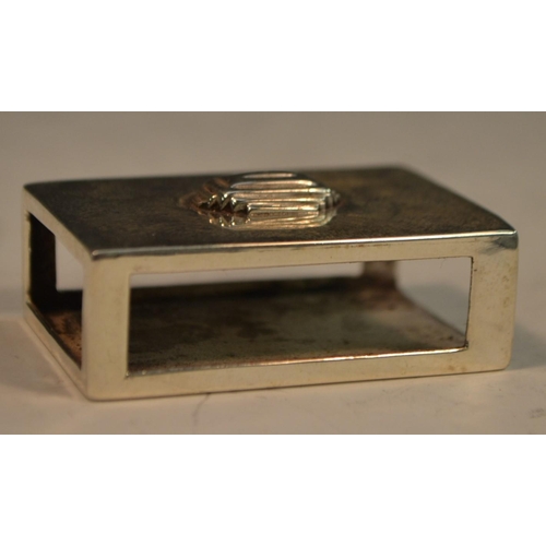 843 - An Art Deco silver matchbox sleeve, planished overall and applied with a geometric lozenge, 4.5cm wi... 