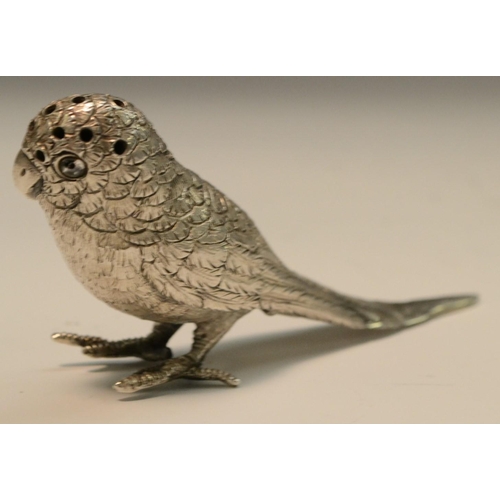 868 - An Edwardian silver novelty pepper, cast as a parakeet, glass eyes, hinged cover to base, 11.5cm lon... 