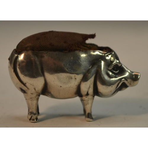 869 - An Edwardian silver novelty pin cushion, as a pig, standing four square, 5cm long, Adie & Lovekin Lt... 