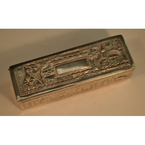 882 - An Indian silver rounded rectangular snuff box, chased with a snake, and buildings in a landscape, h... 