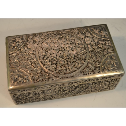 883 - An Indian/Neaplese silver rectangular cigar box, pierced and chased throughout with flowers, blossom... 