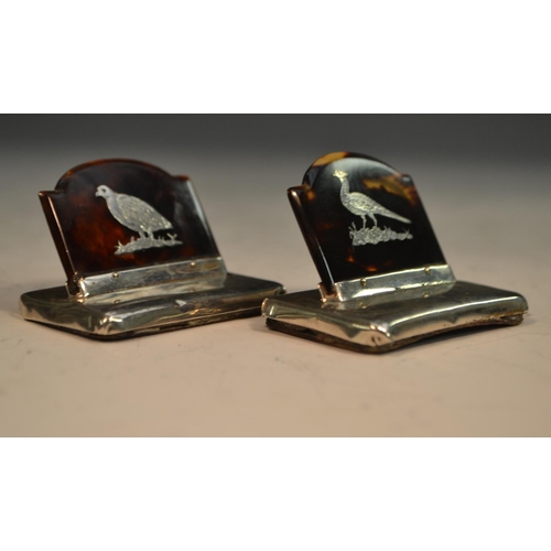 891 - Asprey - a pair of George V silver and tortoiseshell menu holders, each arched rectangular banner in... 