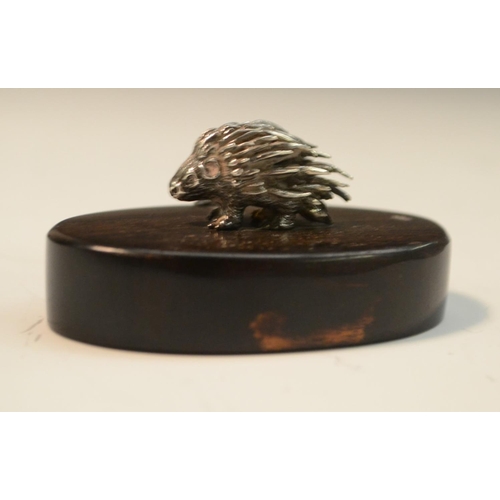 913 - Patrick Mavros - a silver model of a porcupine, hardwood base, 6cm wide