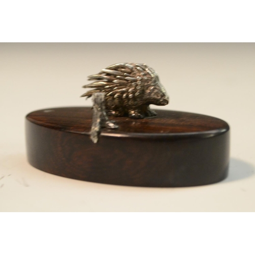 913 - Patrick Mavros - a silver model of a porcupine, hardwood base, 6cm wide