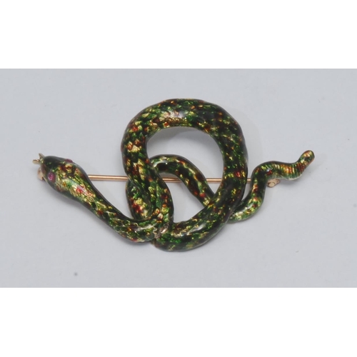 994 - A ruby set enamelled snake brooch , the multi tone green, brown and yellow serpent modelled coiled t... 