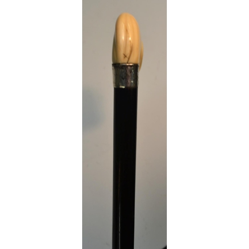 1210 - A George V Japonesque gentleman's silver-mounted ivory and ebony walking cane, the novelty handle ca... 