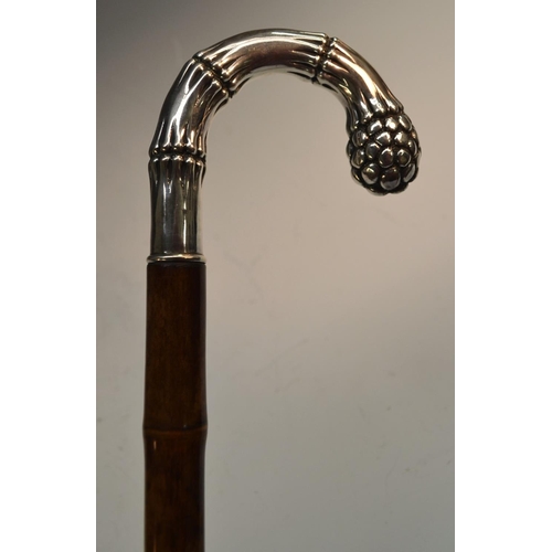 1212 - A German gentleman's silver and bamboo walking stick, the naturalistic crook-shaped handle as sprout... 