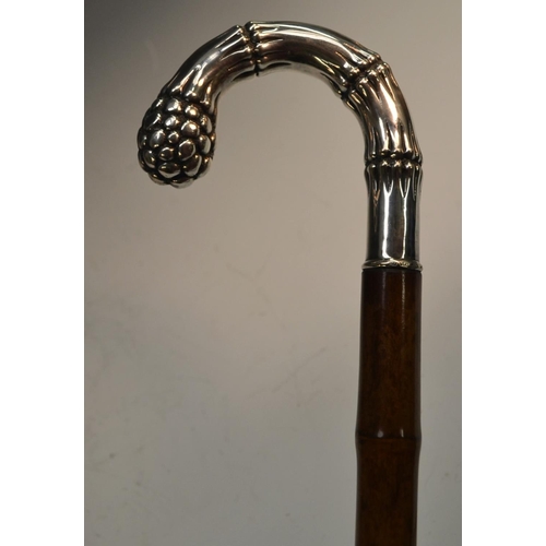 1212 - A German gentleman's silver and bamboo walking stick, the naturalistic crook-shaped handle as sprout... 