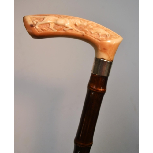 1214 - A late 19th century German gentleman's silver-mounted ivory and bamboo walking stick, the handle car... 