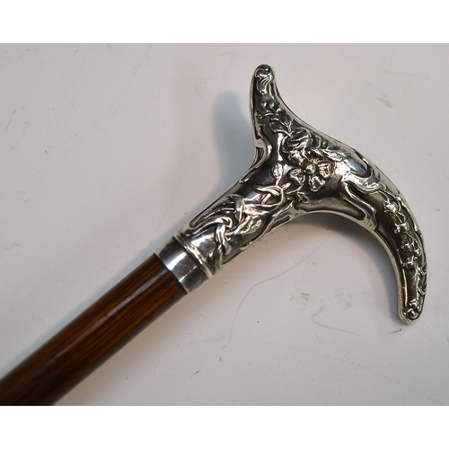 1215 - A French Art Nouveau lady's silver and hardwood walking cane, the cartouche-shaped handle chased wit... 