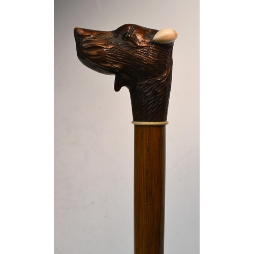 1216 - A Black Forest novelty automaton walking stick, the handle carved as the head of a dog, his mouth mo... 