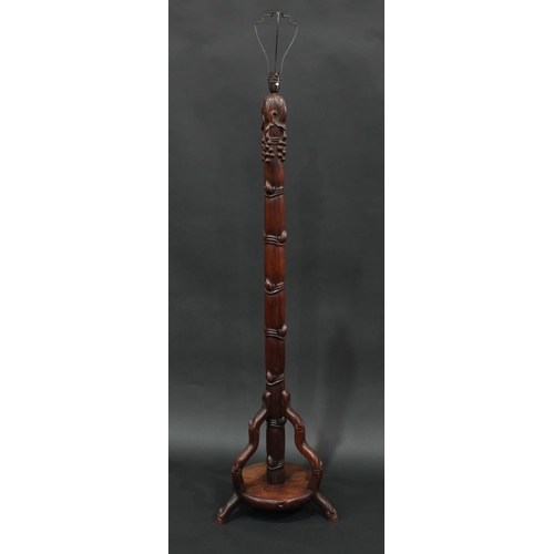 1438 - A Chinese padouk wood standard lamp, capped by fruiting vine and carved throughout with leafy bamboo... 