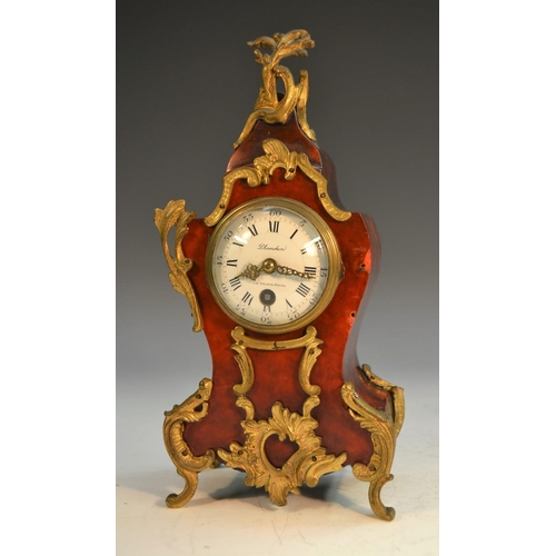 1469 - A French tortoiseshell and gilt metal cartouche shaped mantel clock, the white enamelled dial with R... 