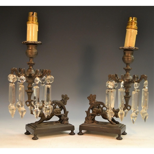 1683 - A pair of Regency dark-patinated bronze mantel lustres, boldly cast as a pair of hounds, each primed... 