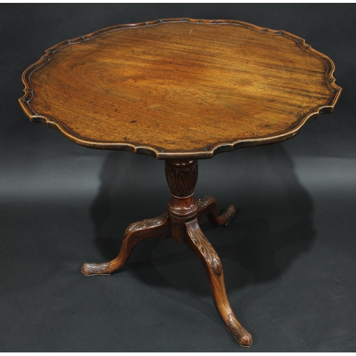 2051 - A George III mahogany piecrust supper table, circular tilting top, turned pillar, cabriole legs carv... 