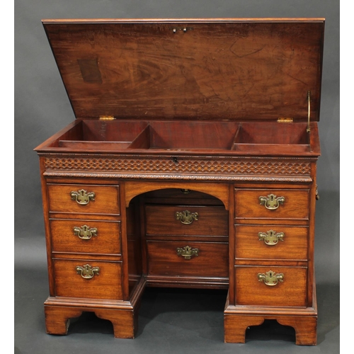 2054 - A George III mahogany gentleman's kneehole desk, hinged top enclosing an arrangement of dressing com... 