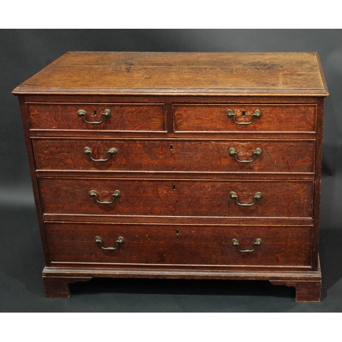 2068 - A George III oak chest, of small proportions, oversailing rectangular top with moulded edge above tw... 