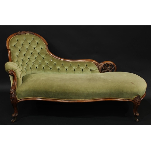 2069 - A Victorian walnut serpentine drawing room chaise longue, pierced and carved with scrolling acanthus... 