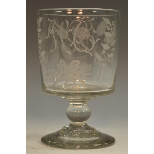 222 - An early 19th century glass rummer, monogrammed cylinder bowl etched and engraved with foliage, 13cm... 