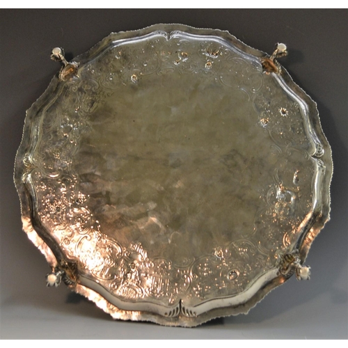 701 - A George III silver shaped circular salver, gadrooned border, the field chased in the Chinoiserie ta... 