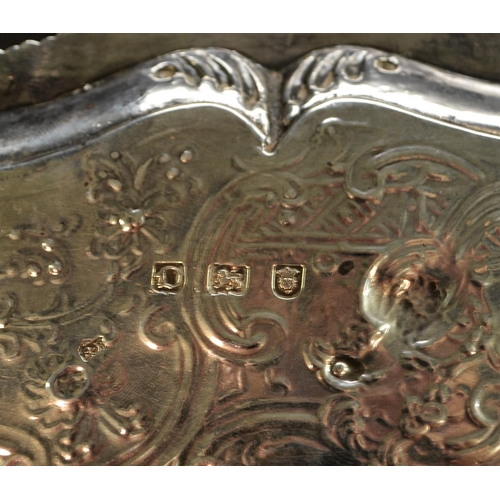 701 - A George III silver shaped circular salver, gadrooned border, the field chased in the Chinoiserie ta... 