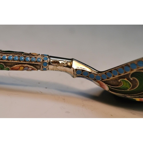 735 - A large Russian silver and cloisonne enamel spoon, decorated in polychrome with flowers and scrollin... 