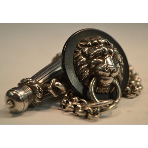 814 - A Victorian silver military officer's whistle, of cannon barrel form, suspension chain and lion mask... 