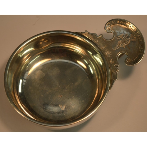 837 - An 18th century French silver wine taster, of heavy gauge, ring and shaped-lug handle bright-cut eng... 