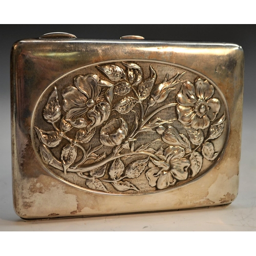 845 - An Art Nouveau silver aide memoire, embossed with flowers within oval reserves, hinged cover enclosi... 