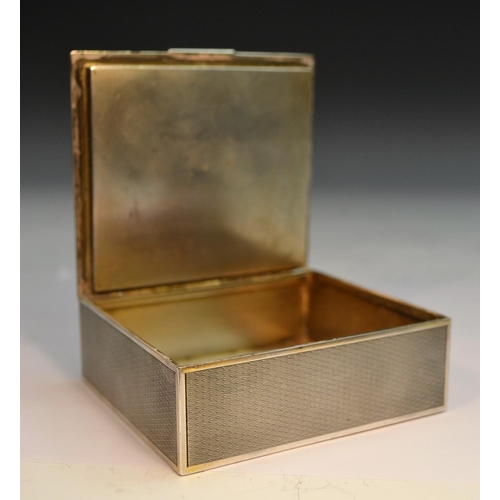 849 - An early 20th century French silver rectangular box, engine turned overall, hinged cover with still ... 