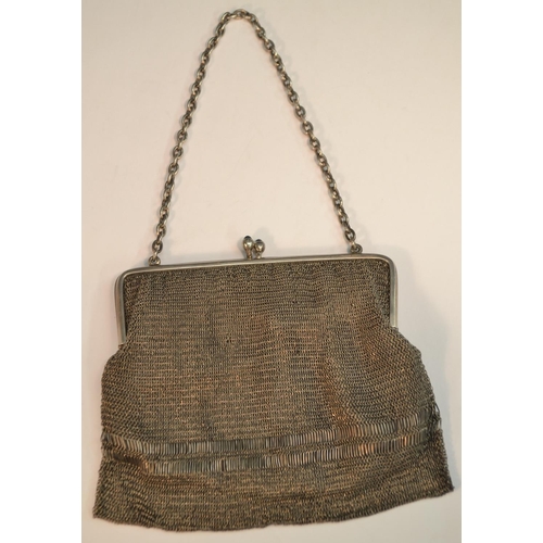 853 - An early 20th century silver mesh evening purse, the clasp set with blue stones, 12.5cm wide, import... 