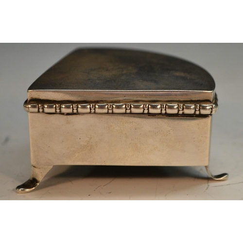 886 - An unusual Edwardian silver segment shaped dressing table ring box, hinged cover enclosing provision... 